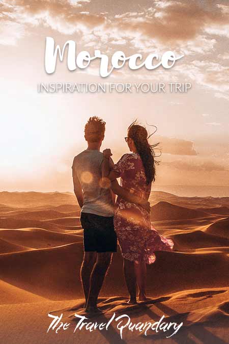 Pin to Pinterest: A couple watch the sunset over the dunes of the Sahara Desert | Morocco Travel Photography
