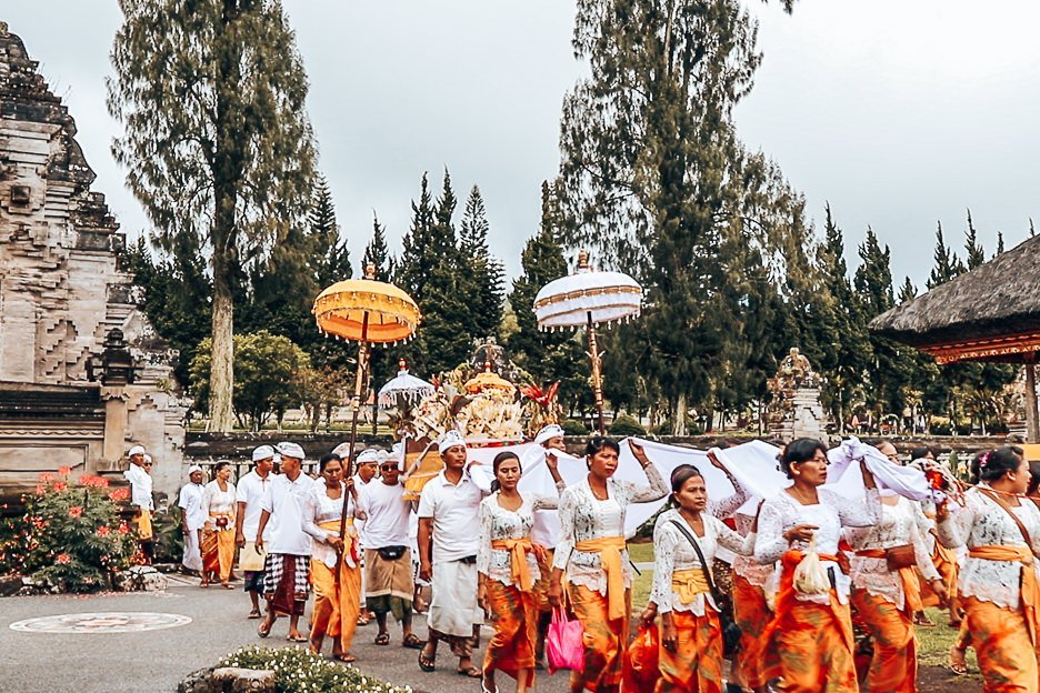 Locals walk into Danu Beratan Temple to pray, Bali Gallery