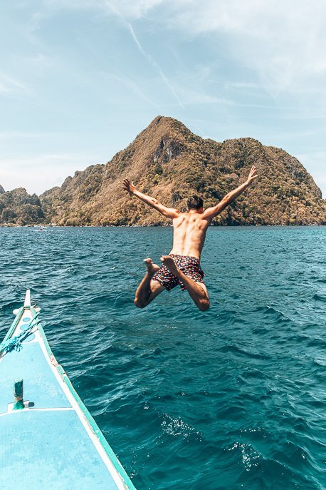 Bevan jumps off the tour boat whilst on Tour D in El Nido