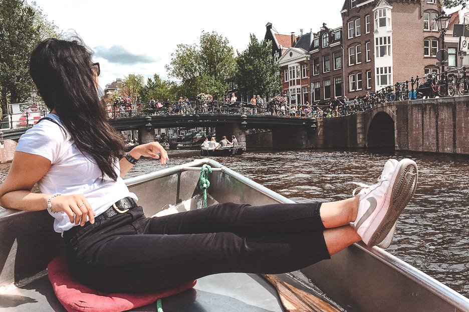 Chilling in a motor boat cruising down the canals in Amsterdam