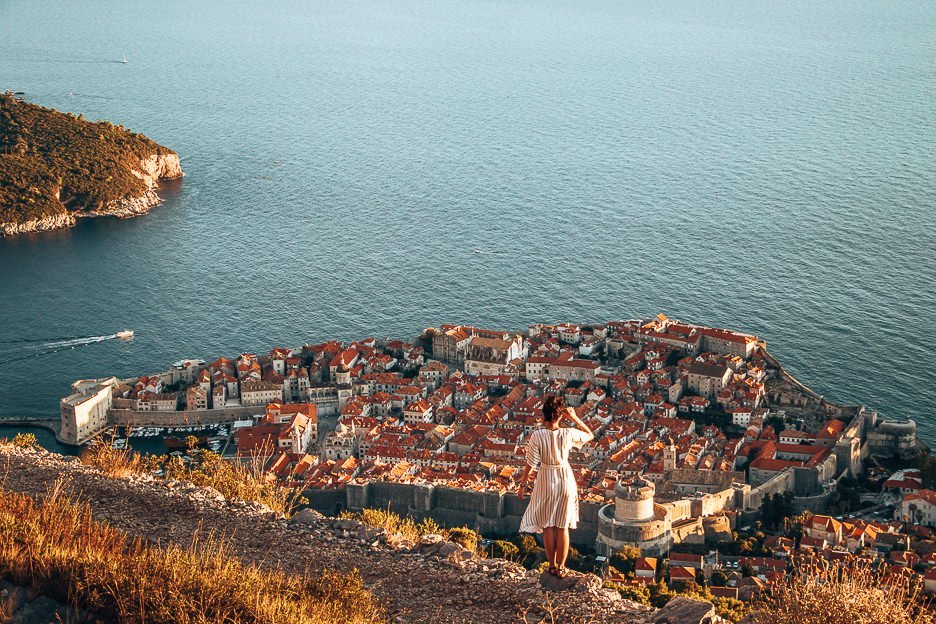 Jasmine looks out over Dubrovnik Old Town at sunset, Croatia