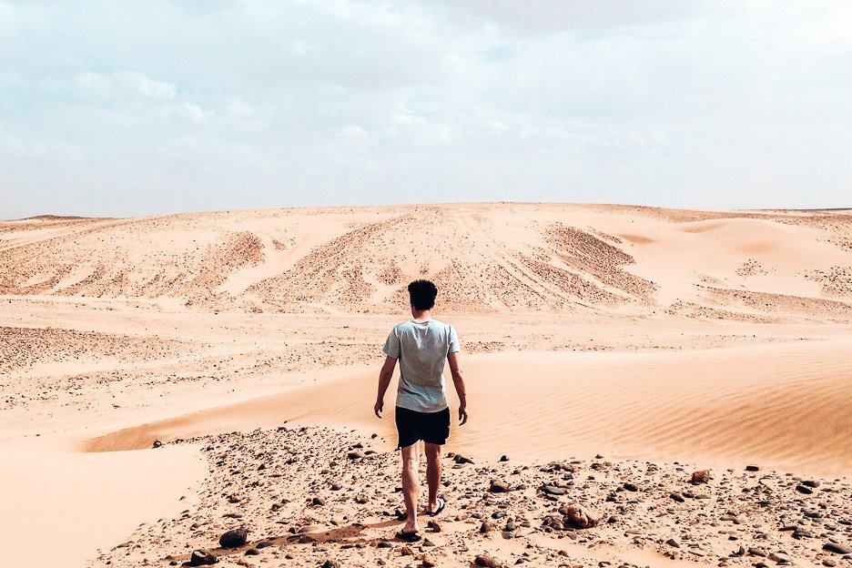 Bevan of the Travel Quandary walking in the Sahara Desert Morocco