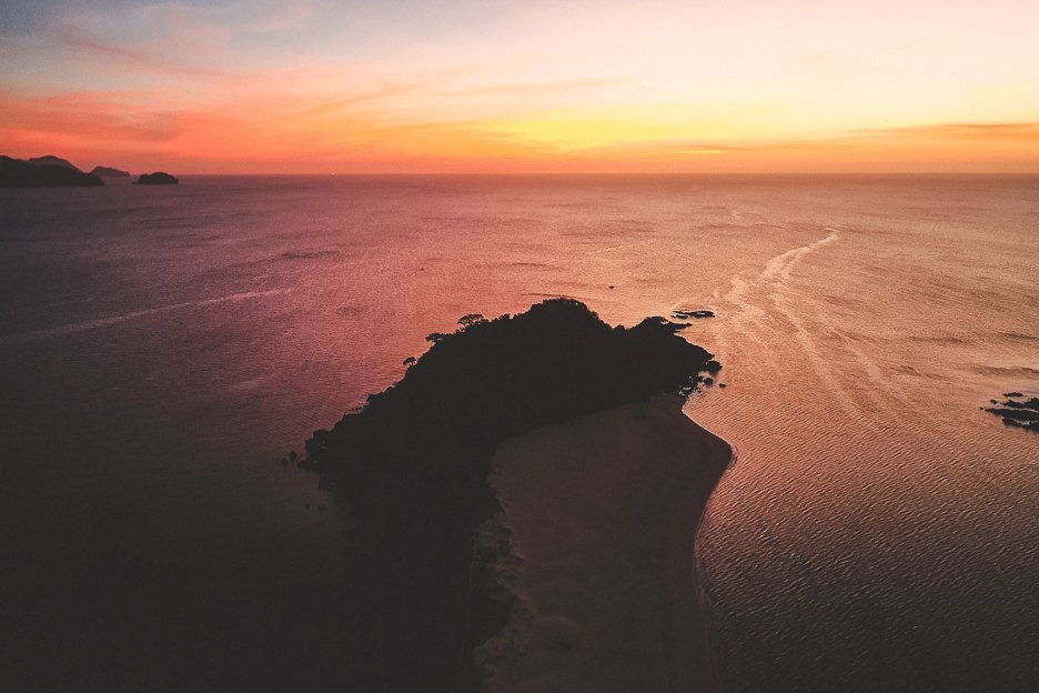 Drone capturing a glorious sunset over Nacpan Beach, El Nido