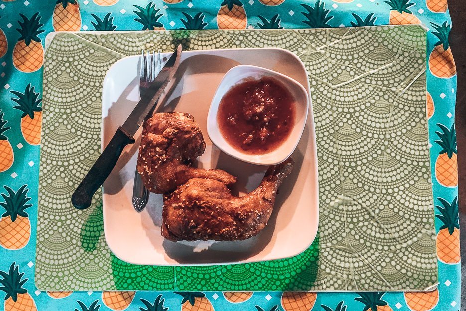 Two pieces of crispy friend chicken with chilli sauce at CFC, Siargao