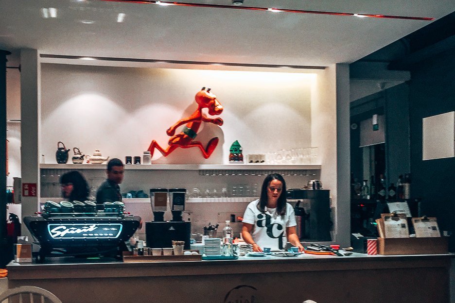 Baristas behind the counter at Wish Coffee, Lisbon Portugal