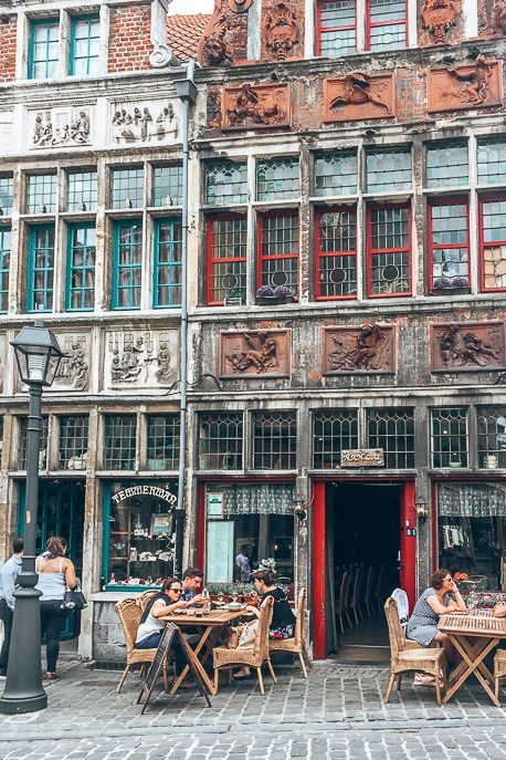 Diners sit outside a restaurant in Ghent, Belgium