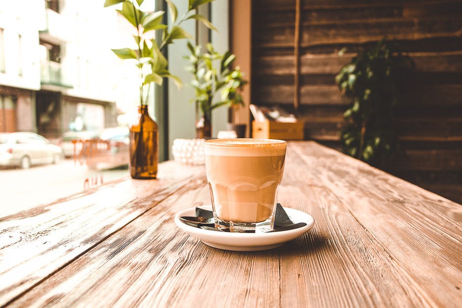 A freshly prepared latte sits in the window sill at Rocket Bean Roastery in Riga, Latvia