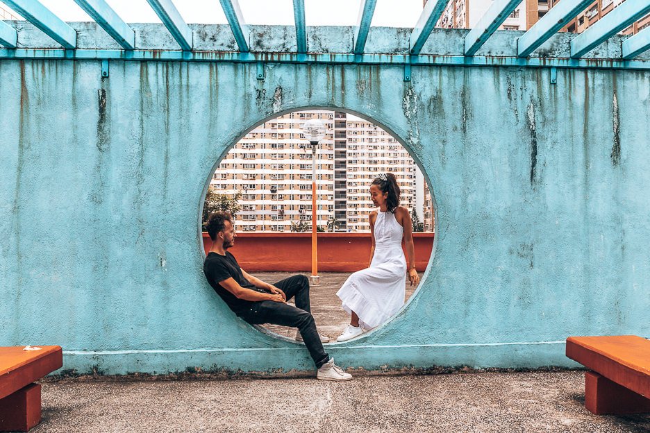 A couple pose in one of the circles of Lok Wah South Estate Car Park, Hong Kong