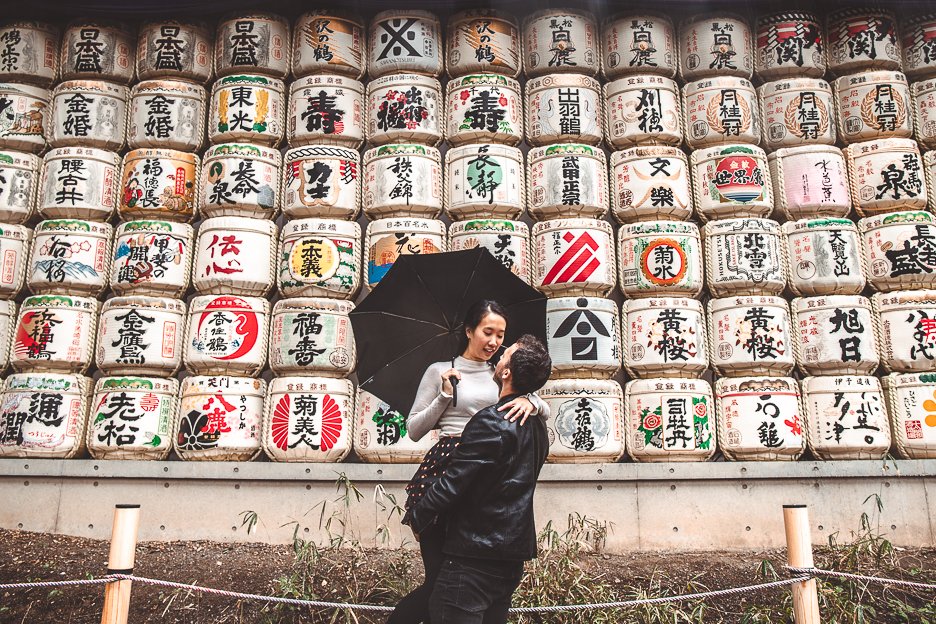 A couple pose in front of the sake barrels at Meiji Jinku, next to Yoyogi Park | Shibuya what to see