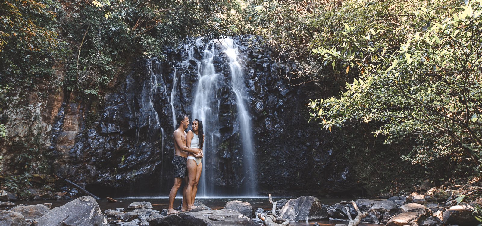 A couple pose for a photo at Ellinjaa Falls