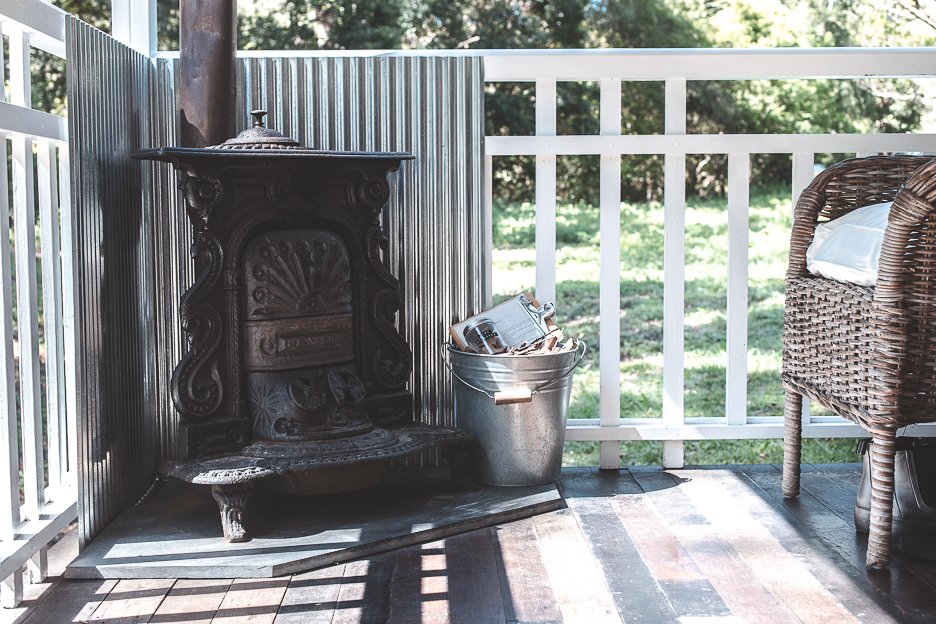 Cast iron fireplace on the porch - Palmer & Gunn